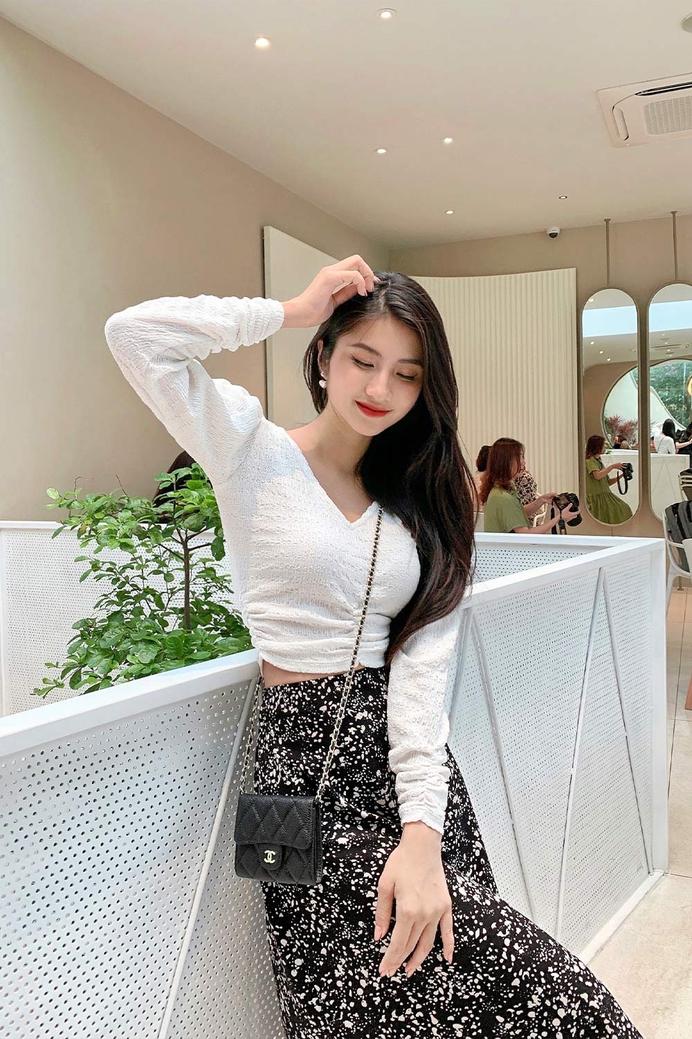 Áo kiểu nữ croptop xoắn eo tay dài 