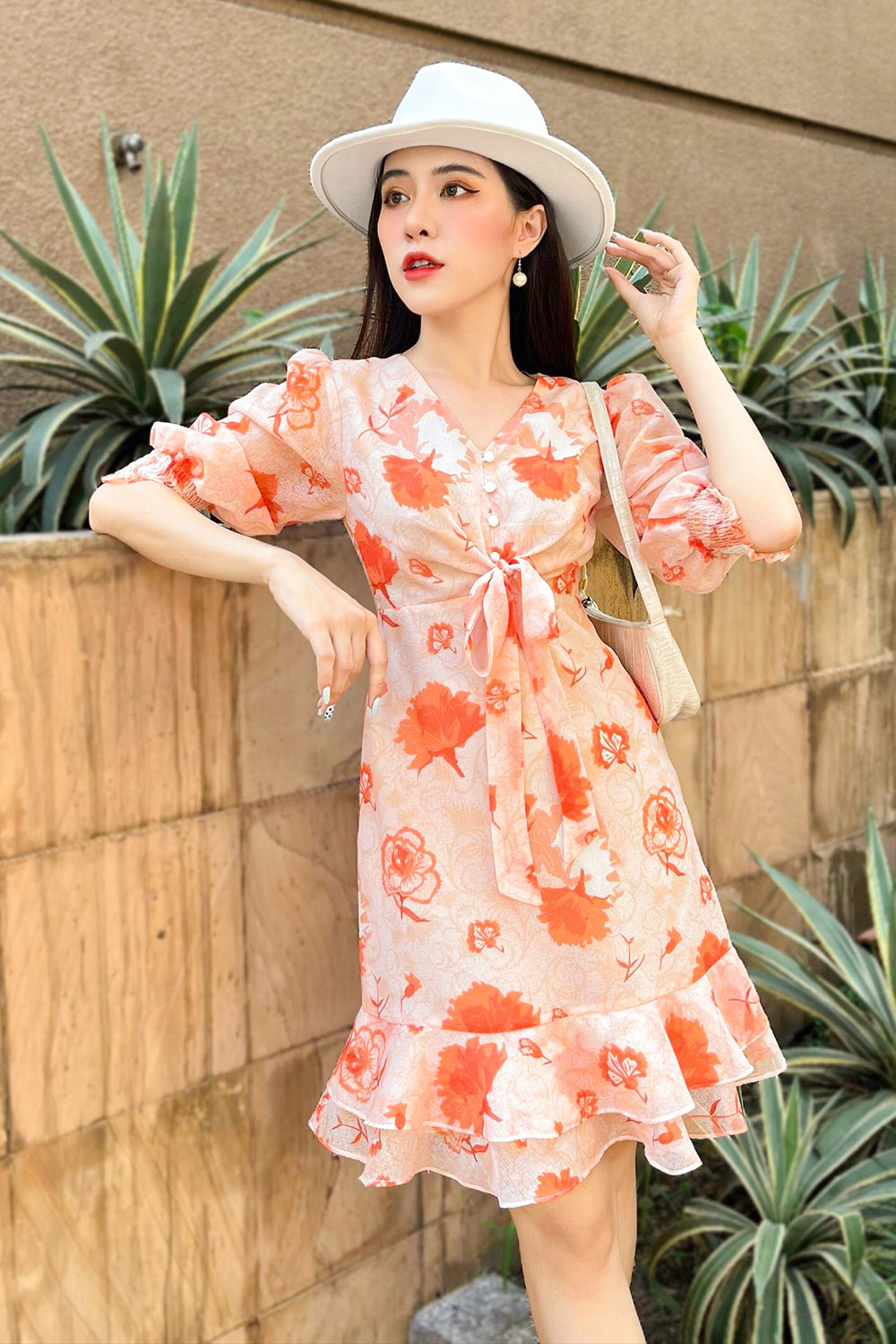 Đầm hoa chữ A đuôi cá phối nơ ở ngực