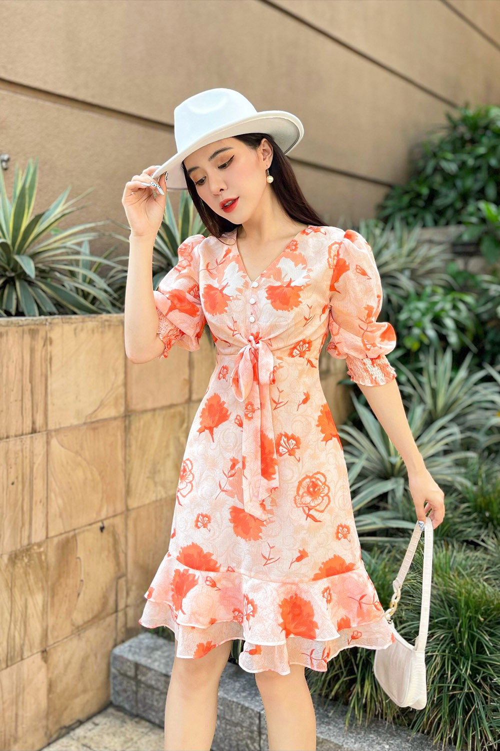 Đầm hoa chữ A đuôi cá phối nơ ở ngực