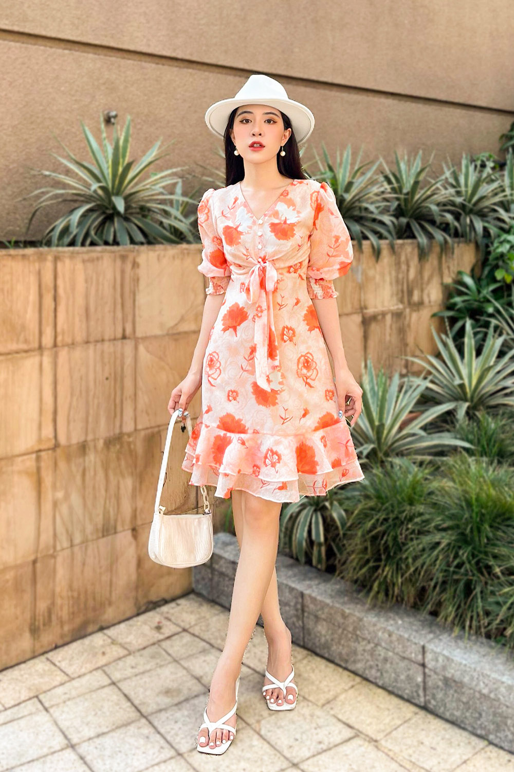 Đầm hoa chữ A đuôi cá phối nơ ở ngực