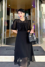 Đầm đen dáng xòe phối nơ ngực
