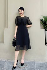 Đầm đen dáng xòe phối nơ ngực