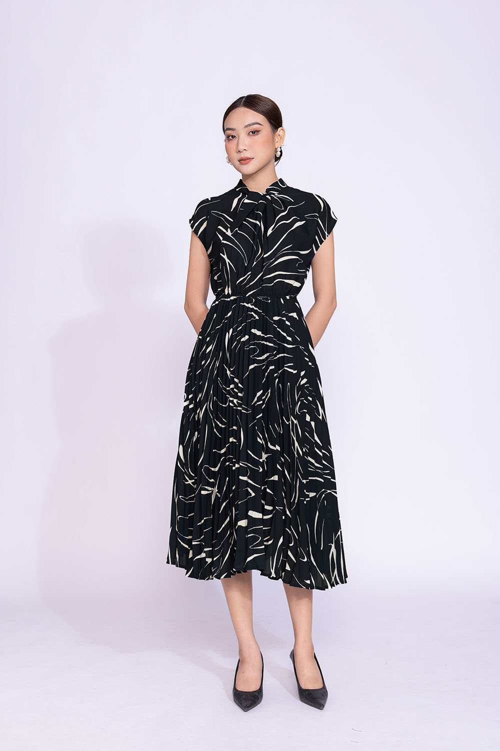 Đầm midi xếp ly tay hến phối nơ