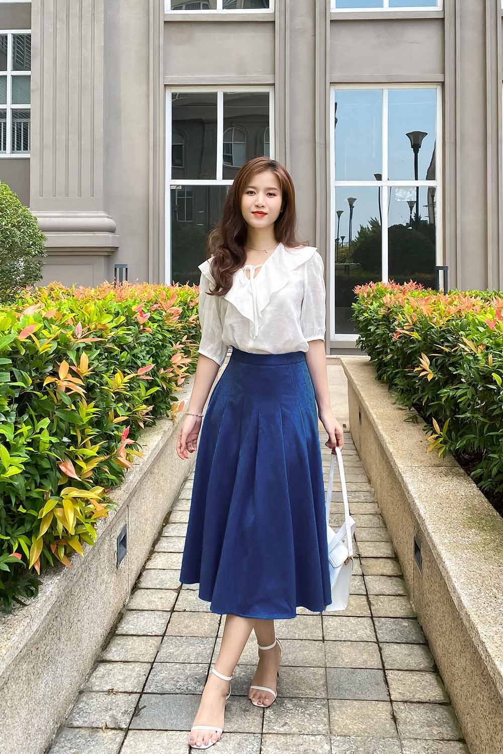 Chân váy midi dáng xòe xếp ly