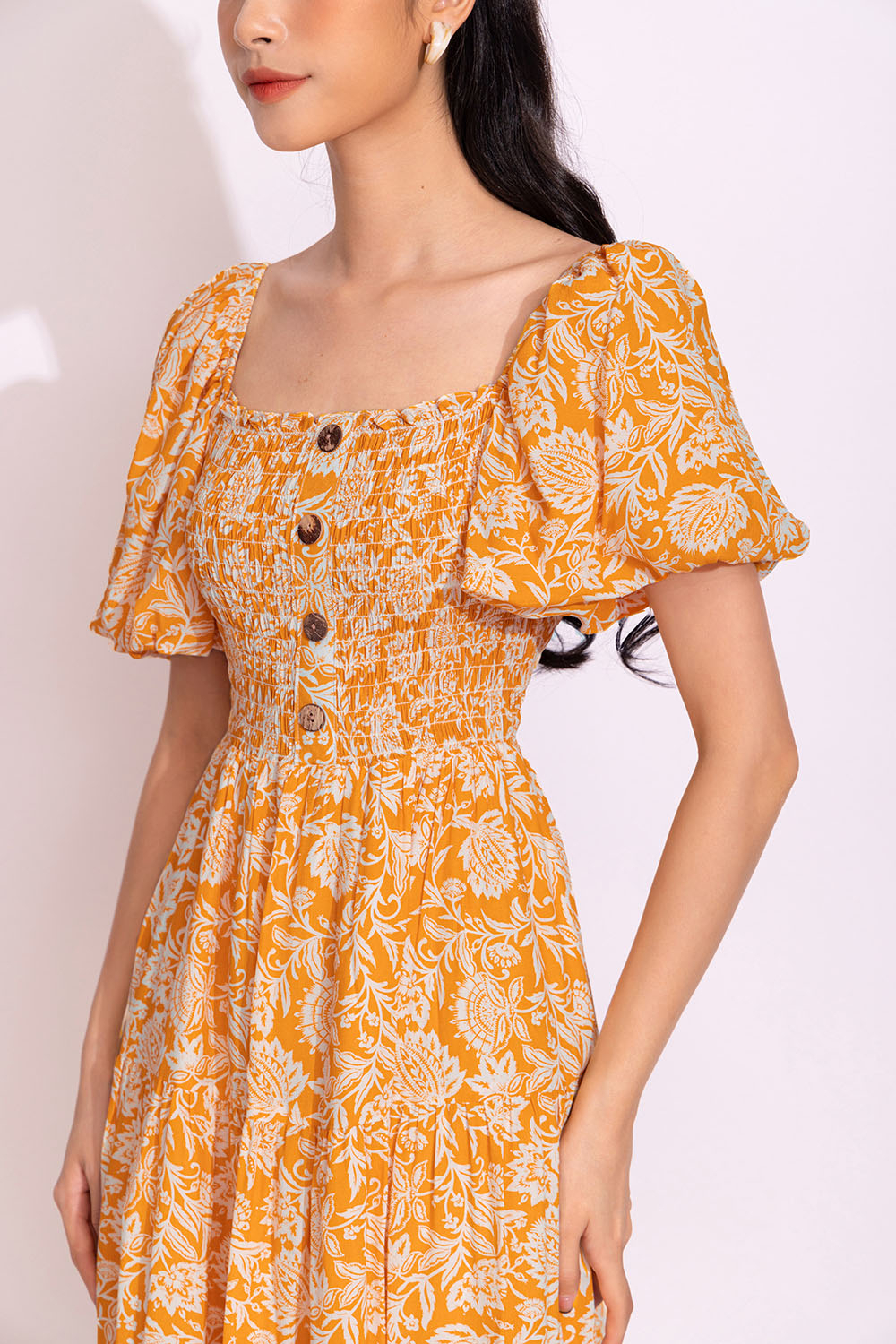 Đầm xòe dáng dài bo chun ngực phối nút