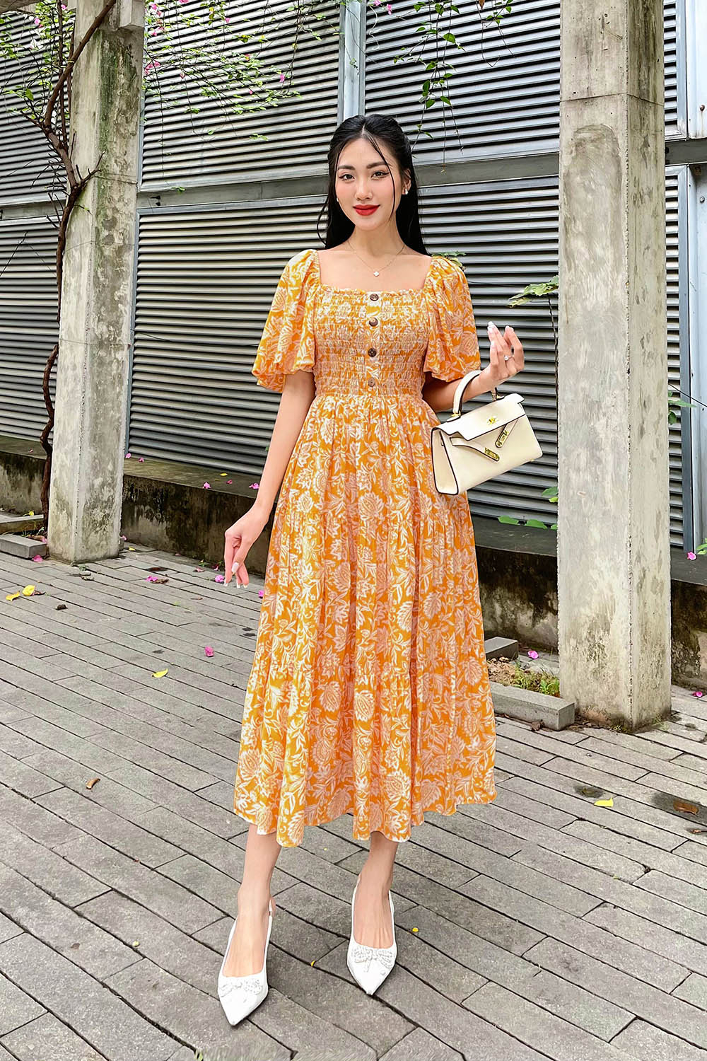 Đầm xòe dáng dài bo chun ngực phối nút