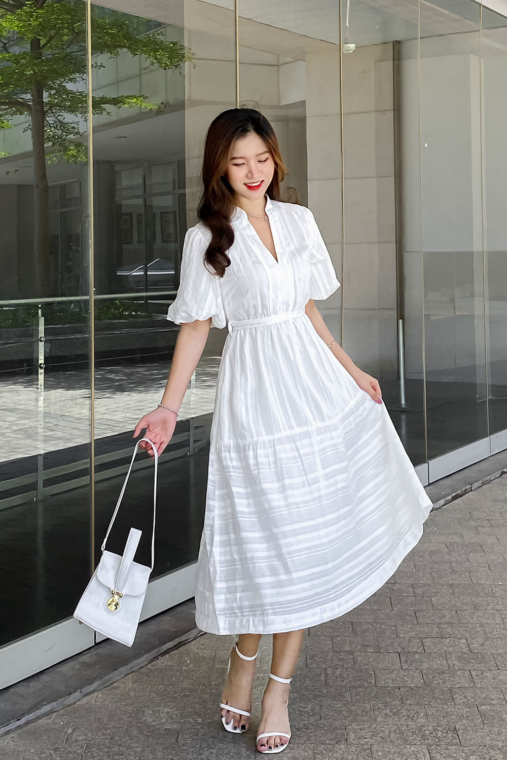 Đầm xòe trắng thắt nơ eo tay phồng