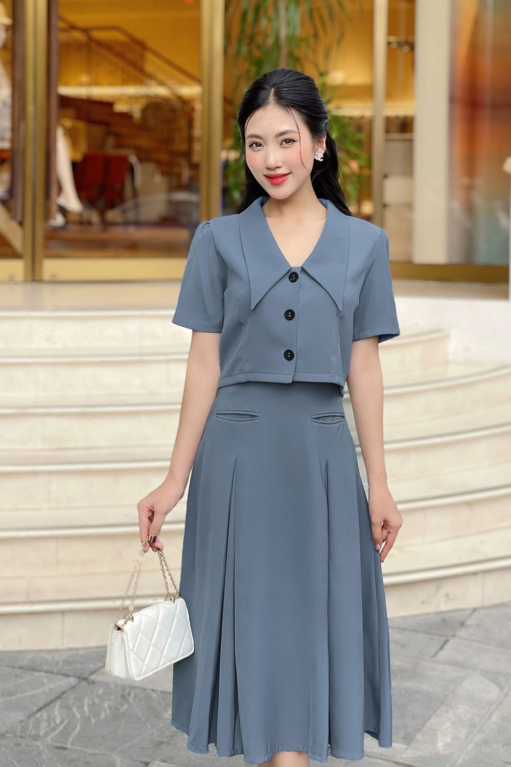 Chân váy công sở dáng xòe phối hai túi trước