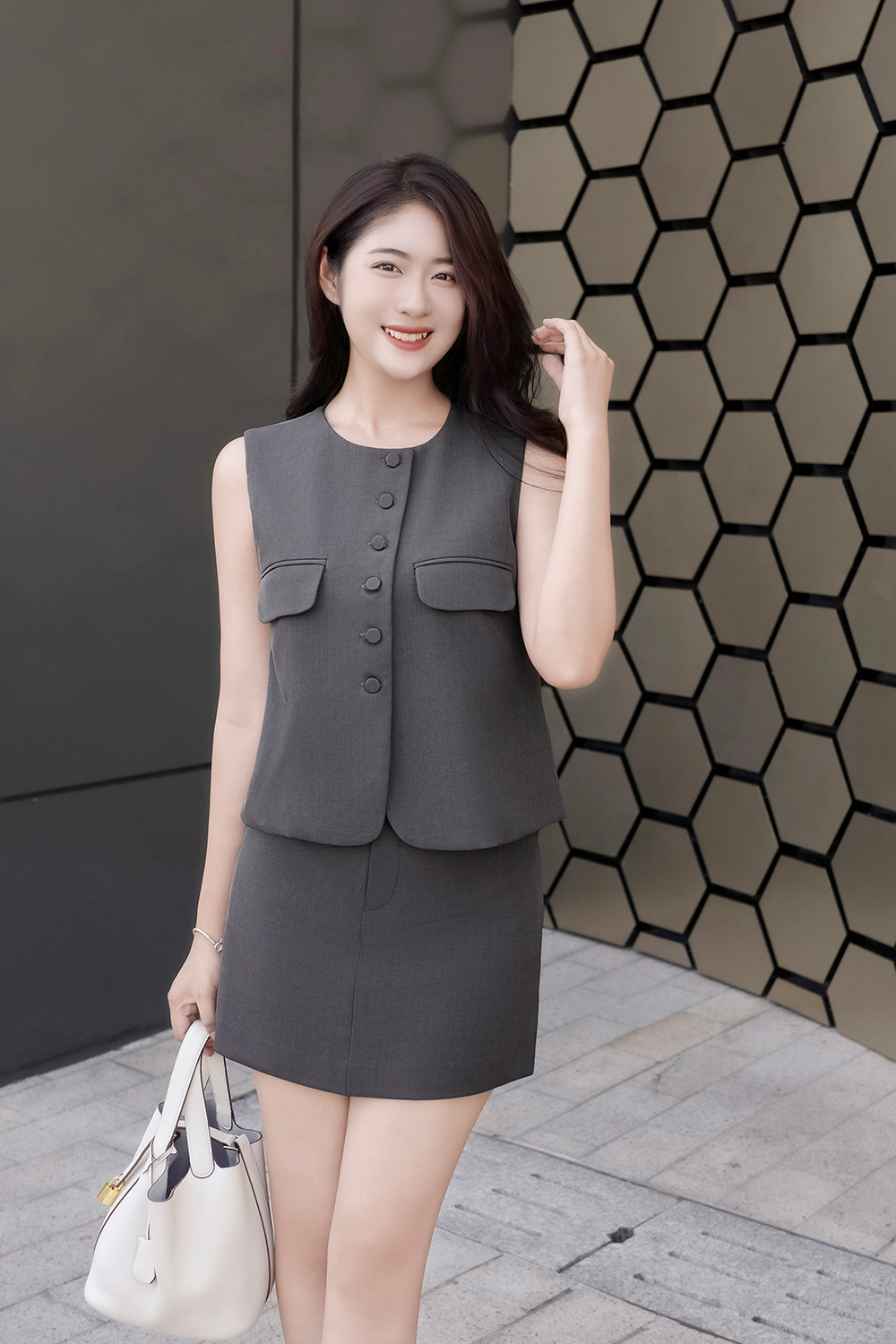 Áo kiểu nữ phối túi sát nách màu xám