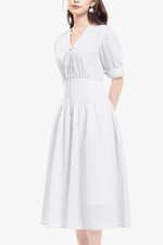 Đầm xòe linen trắng kẻ sọc cổ phối nơ