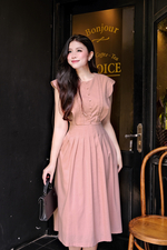 Đầm xòe hồng tay hến phối nút