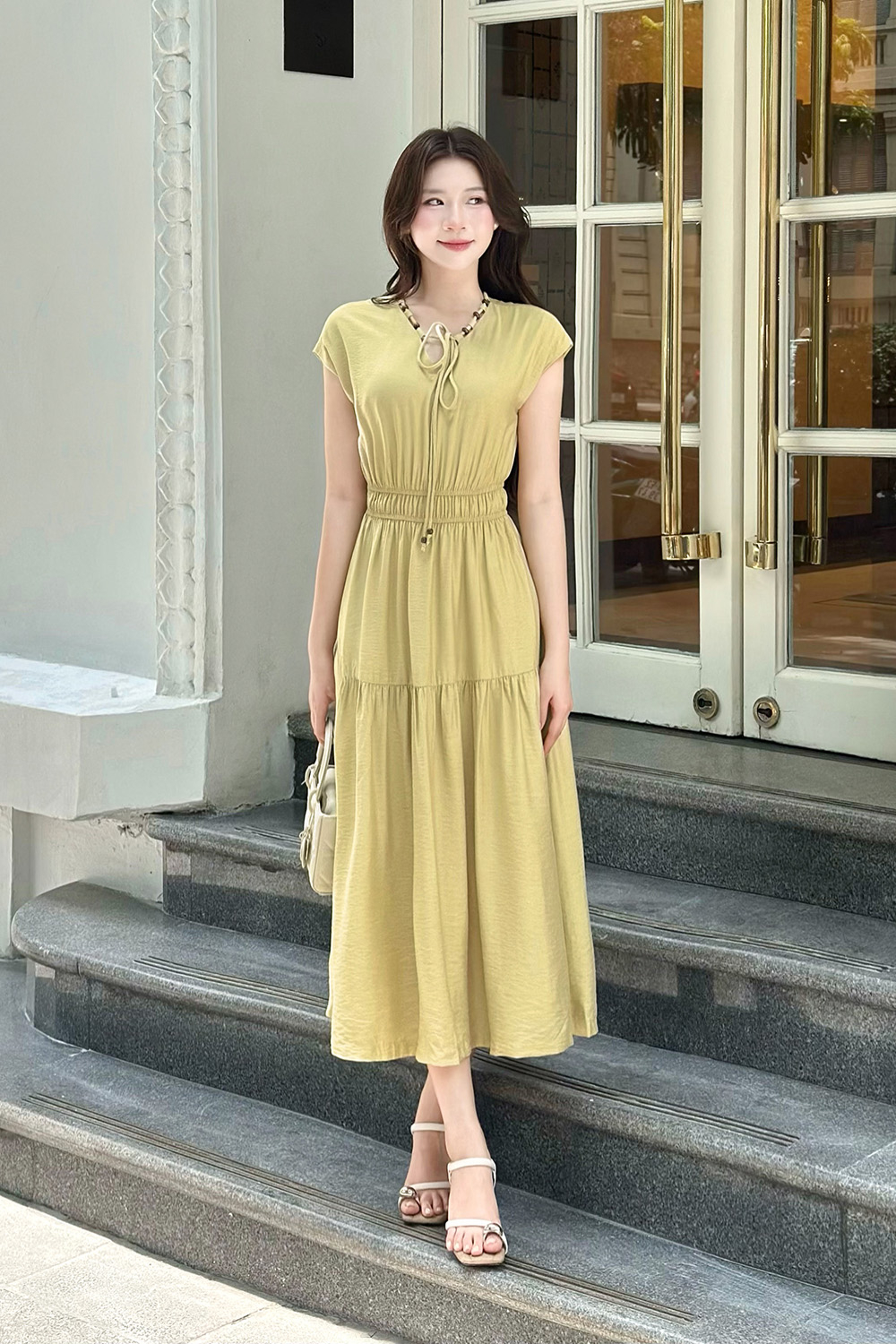 Đầm xòe dáng dài tay hến phối hạt gỗ