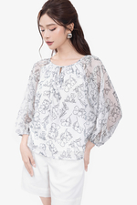 Áo kiểu nữ màu trắng họa tiết đen