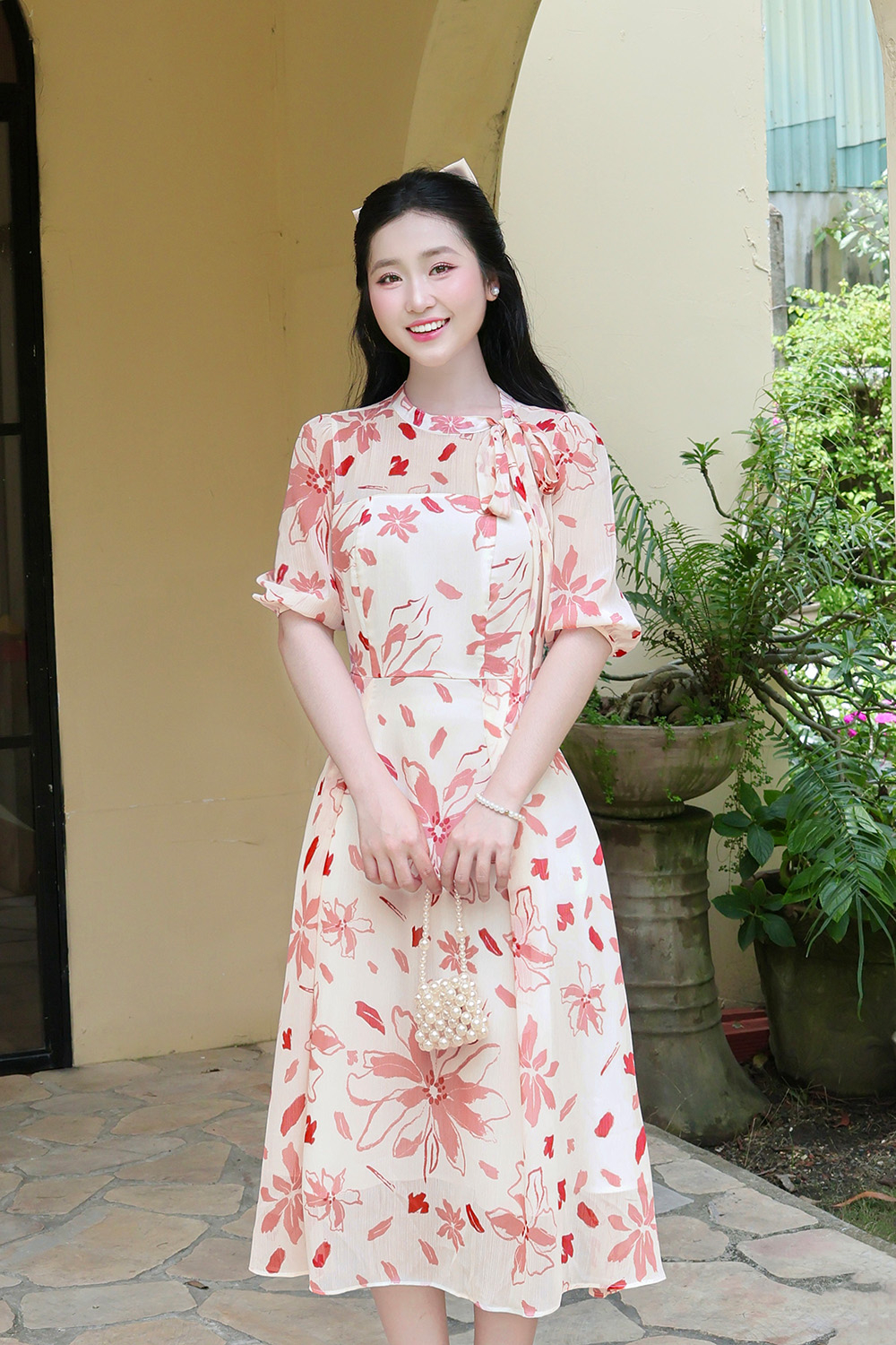 Đầm hoa dáng xòe tay phồng cổ phối nơ