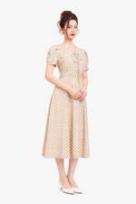 Đầm họa tiết chữ A xòe cổ V phối nơ