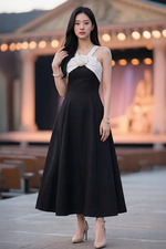 Đầm đen dự tiệc 2 dây đính nơ hoa trắng