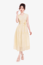 Đầm tơ xòe màu kem cổ V đính hoa eo