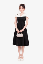 Đầm đi tiệc tafta chữ A đen phối trắng tay cape