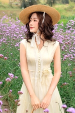 Đầm tơ xòe màu kem cổ V đính hoa eo