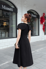 Đầm xòe đen tay choàng phối nơ