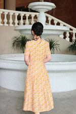 Đầm hoa nhí dáng xòe đính nút