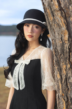 Đầm đen xòe chữ A phối ren kem cổ đính nơ