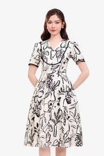 Đầm trắng họa tiết màu đen phối đăng ten