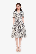 Đầm trắng họa tiết màu đen phối đăng ten