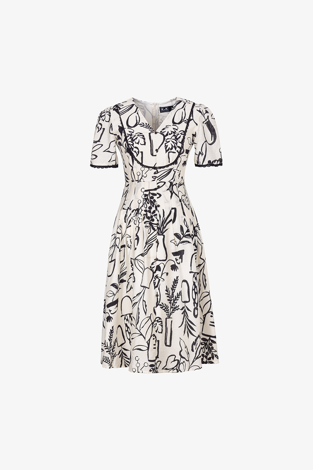 Đầm trắng họa tiết màu đen phối đăng ten