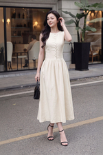 Đầm linen dáng xòe midi sát nách phối nút