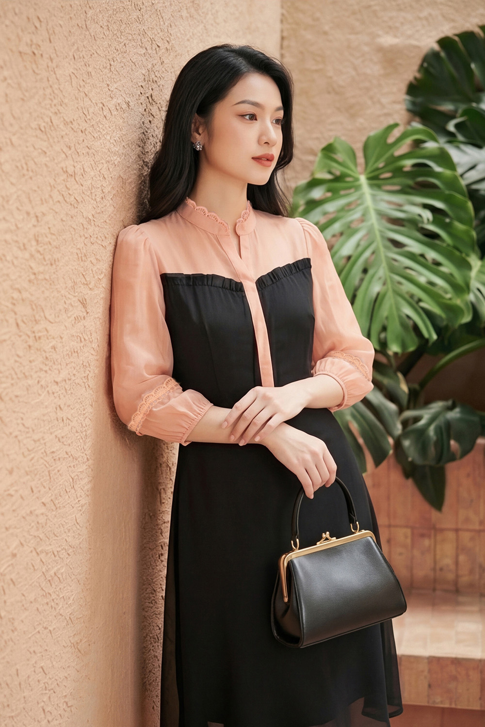 Đầm đen dáng xòe phối màu cam tay lỡ