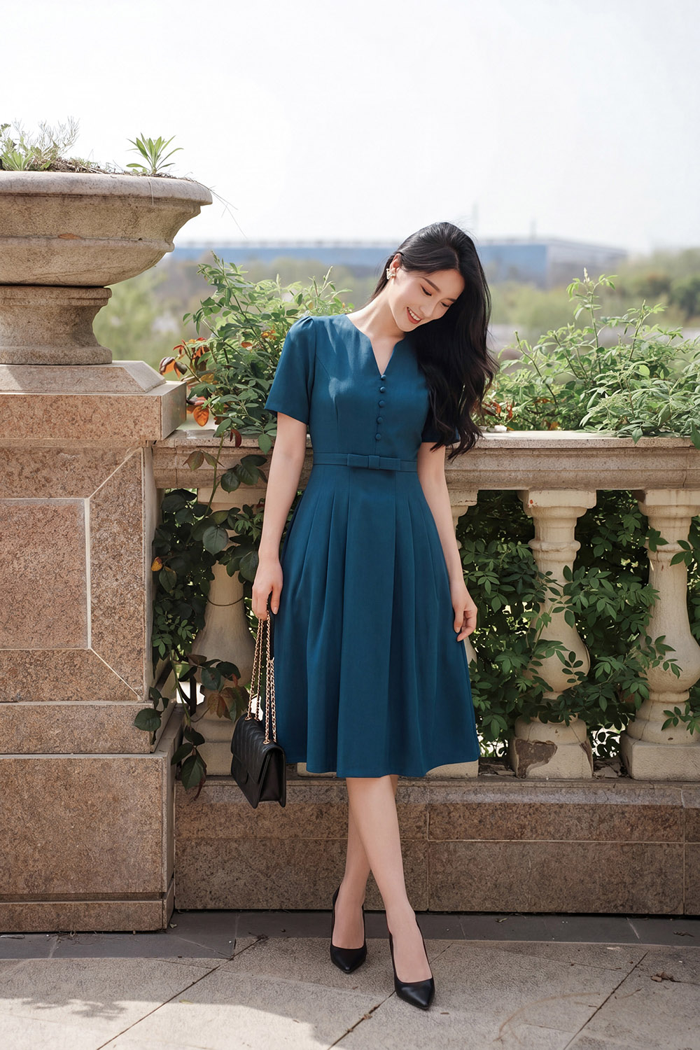 Đầm công sở dáng xòe xếp ly eo đính nơ