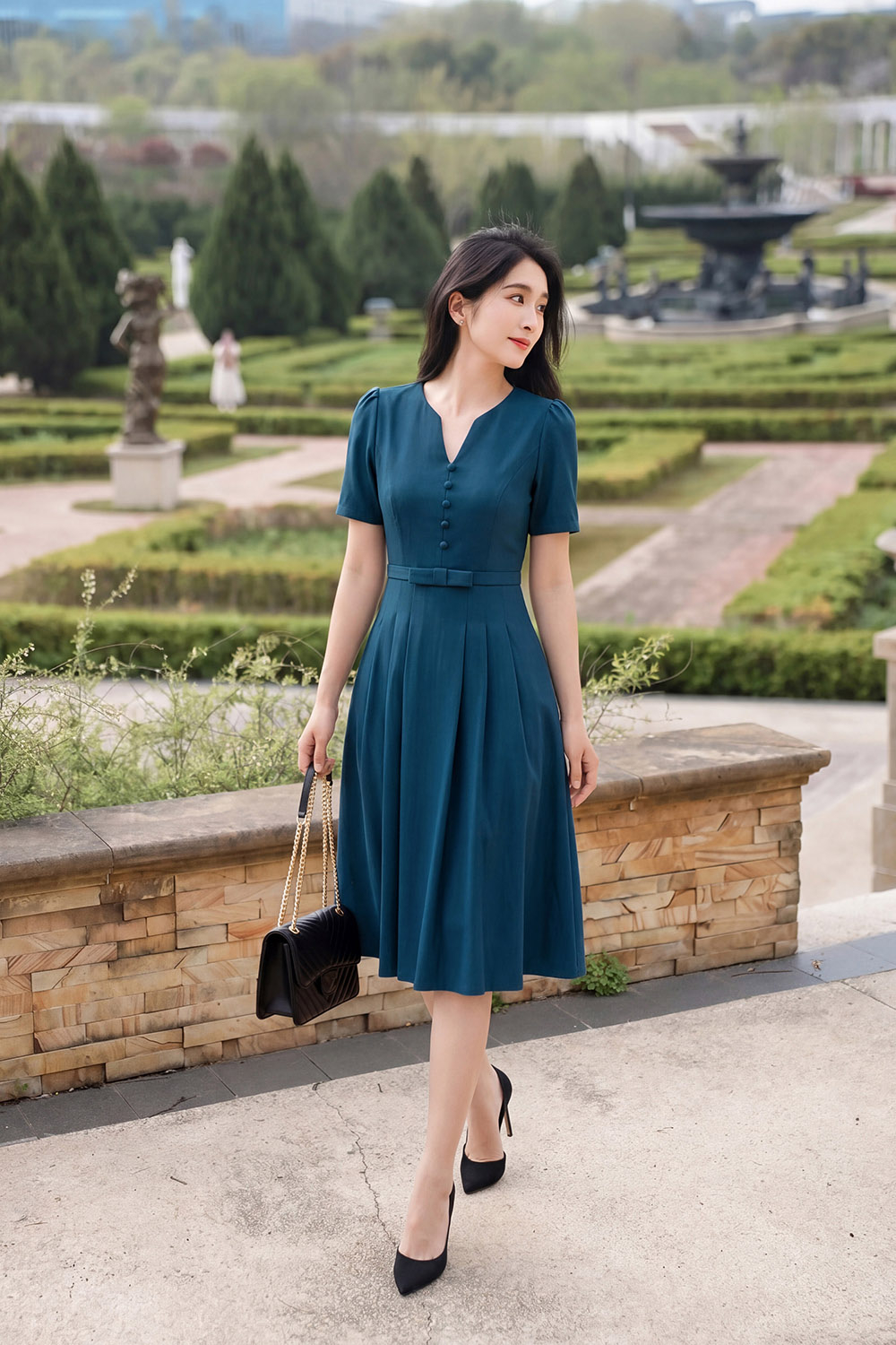 Đầm công sở dáng xòe xếp ly eo đính nơ