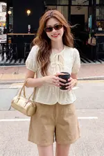 Áo baby doll màu kem tay phồng phối nơ