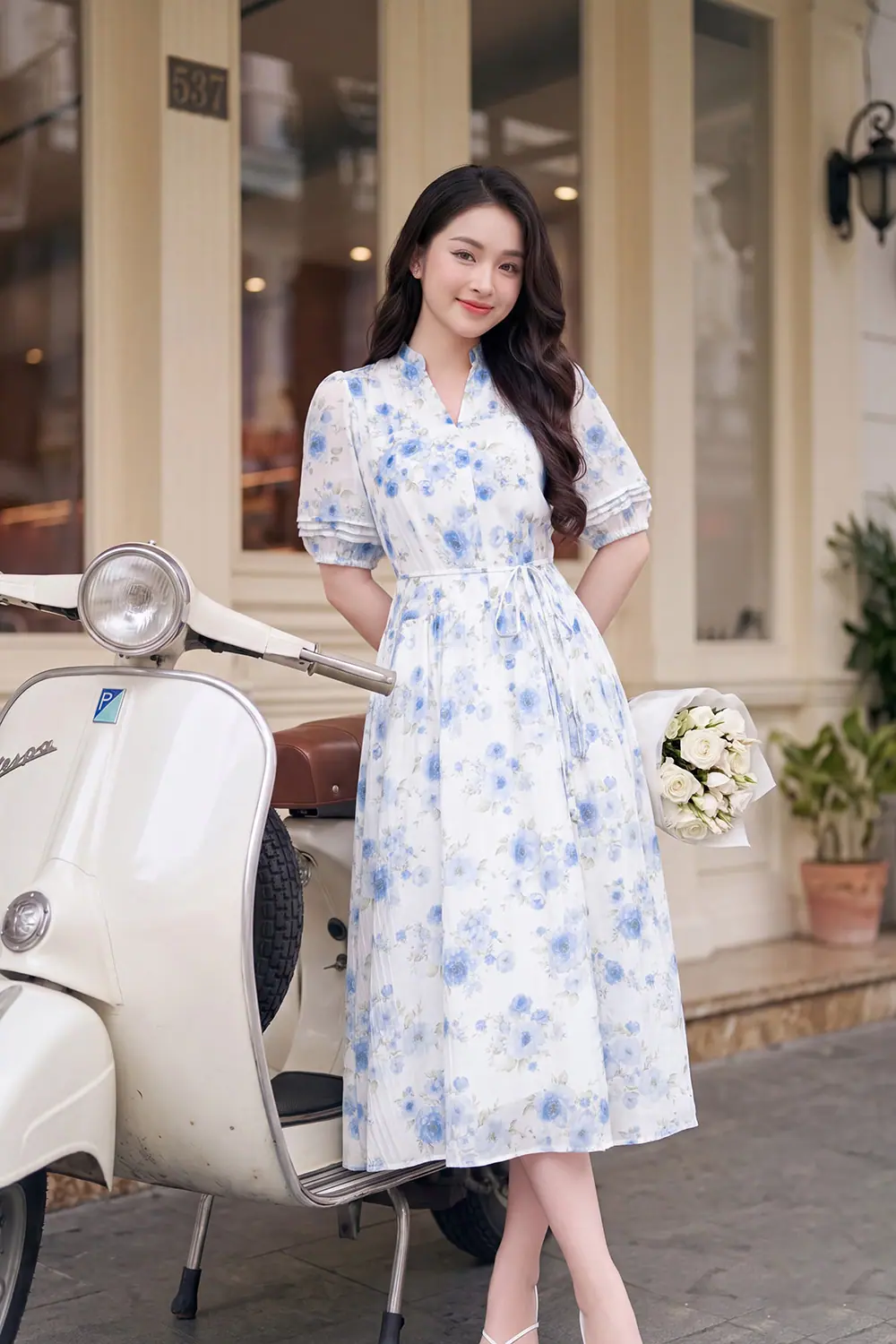 Đầm hoa dáng xòe cổ xẻ V thắt nơ eo