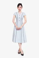 Đầm xòe chữ A màu xanh viền đen đính nút