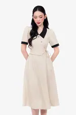 Đầm xòe màu kem phối đen nhấn nơ eo