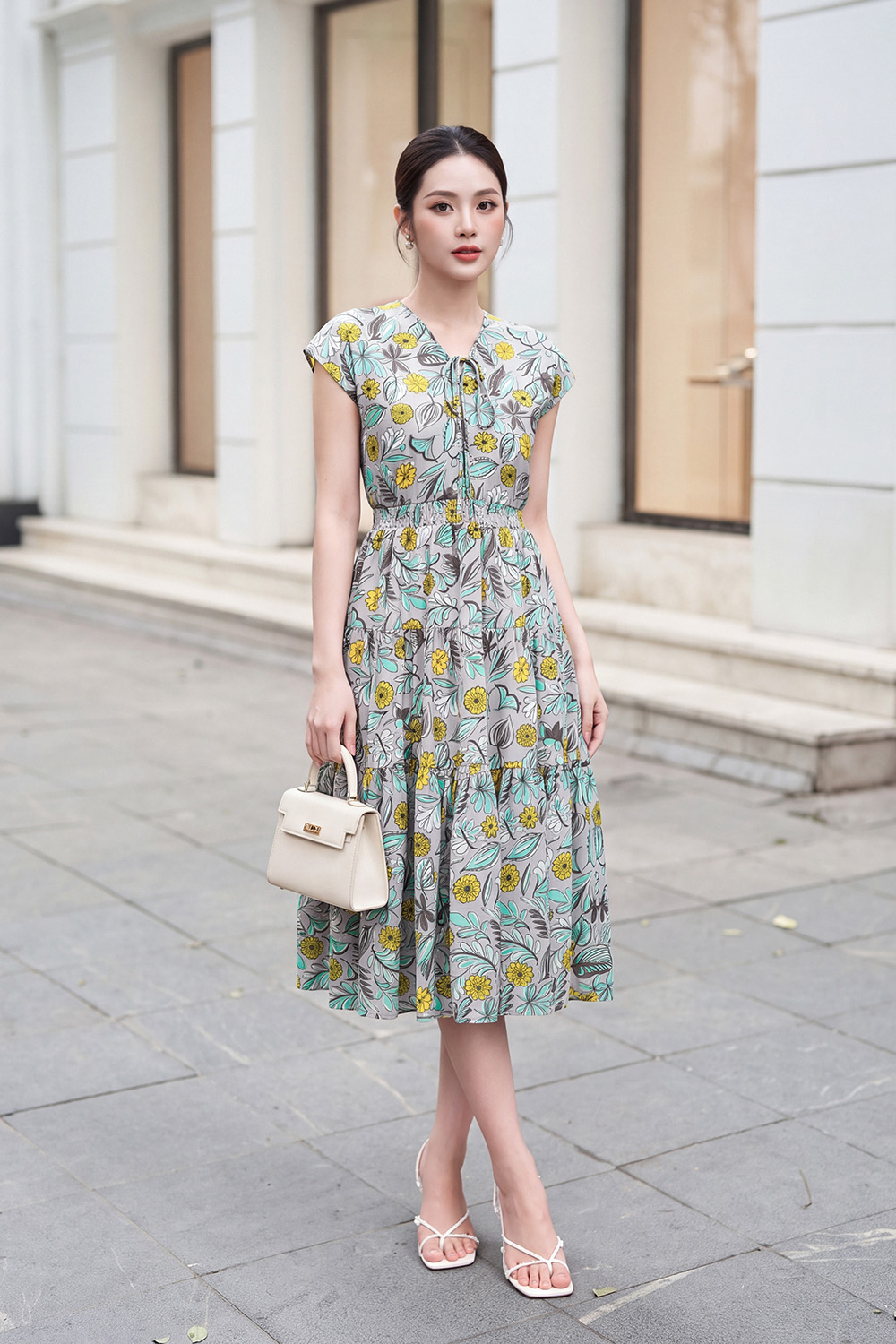 Đầm xòe họa tiết eo bo chun cổ V phối nơ